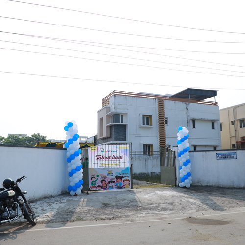 Classroom interior at Waddle Kids Sholinganallur — bright, print-rich learning environment
