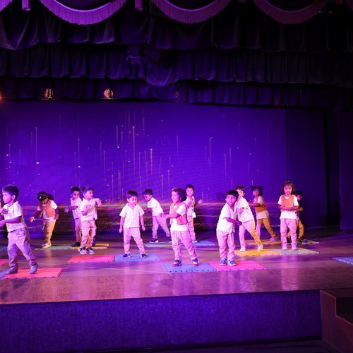 Kids dance performance on stage at Waddle Kids — cultural festival event, Chennai