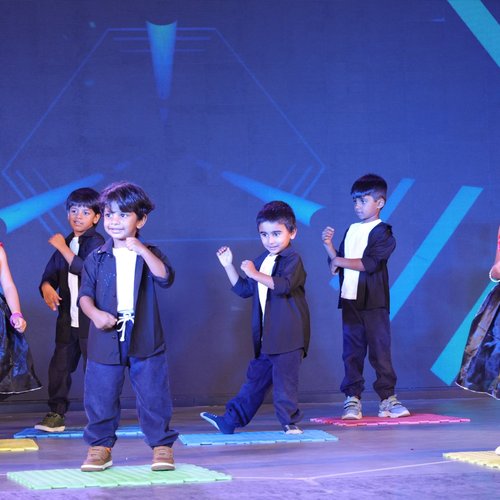 Preschool children dressed in traditional costumes for a festival celebration at Waddle Kids