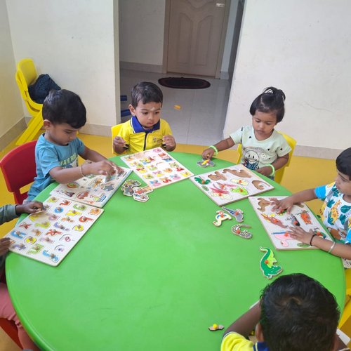 Puzzle time at Waddle Kids — building spatial reasoning and concentration in young children