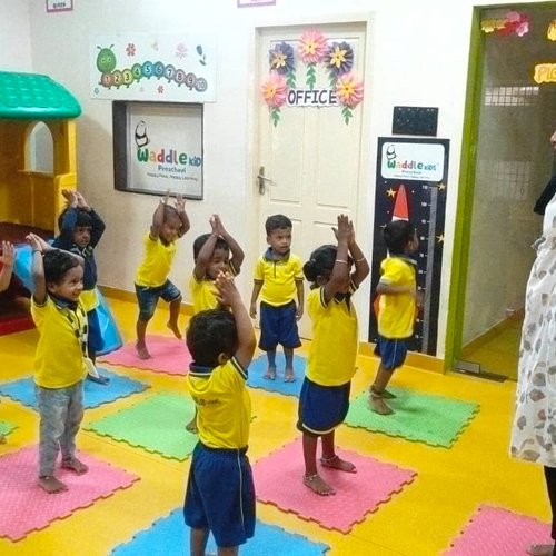 Guided yoga and movement class at Waddle Kids — early childhood physical development