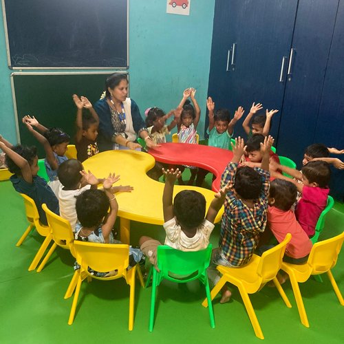 Group activity session in a Waddle Kids classroom — children collaborating on a project