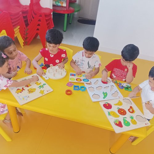 Children solving puzzles to develop problem-solving skills at Waddle Kids Chennai