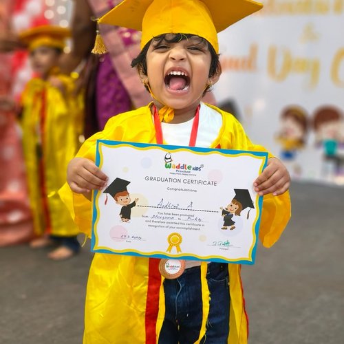 Graduation ceremony at Waddle Kids Preschool — children receiving their certificates