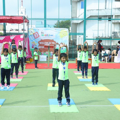 Kids competing in a fun race on Sports Day at Waddle Kids Preschool Sholinganallur
