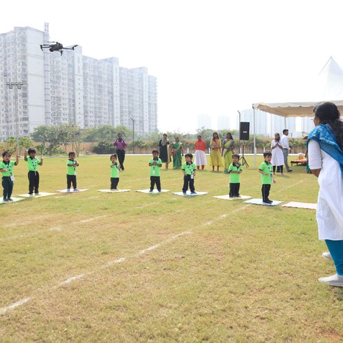 Group physical fitness activity for preschool children at Waddle Kids Sports Day